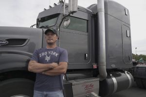 Man standing by truck.