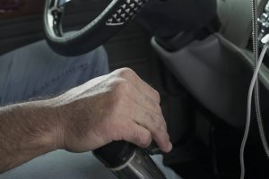 Hand shifting gears