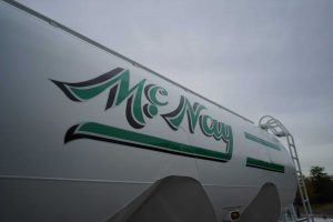 McNay logo on side of liquid truck tank.