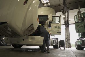 Man working on truck.