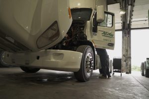 Man working on truck.