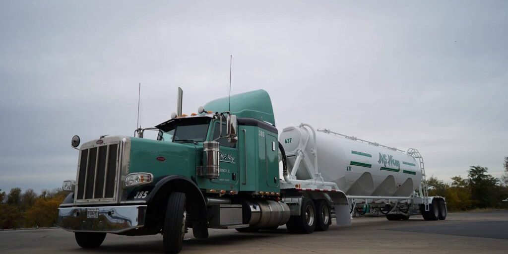 Liquid truck in parking lot.